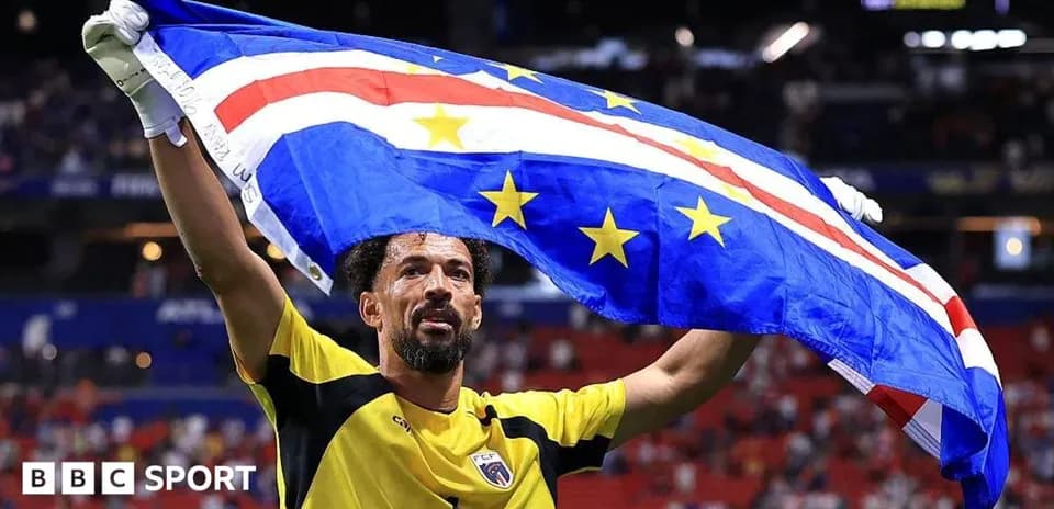 Goalkeeper celebrating with Cape Verde flag after match