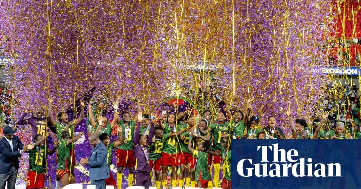 Cameroon team celebrating victory with confetti and medals
