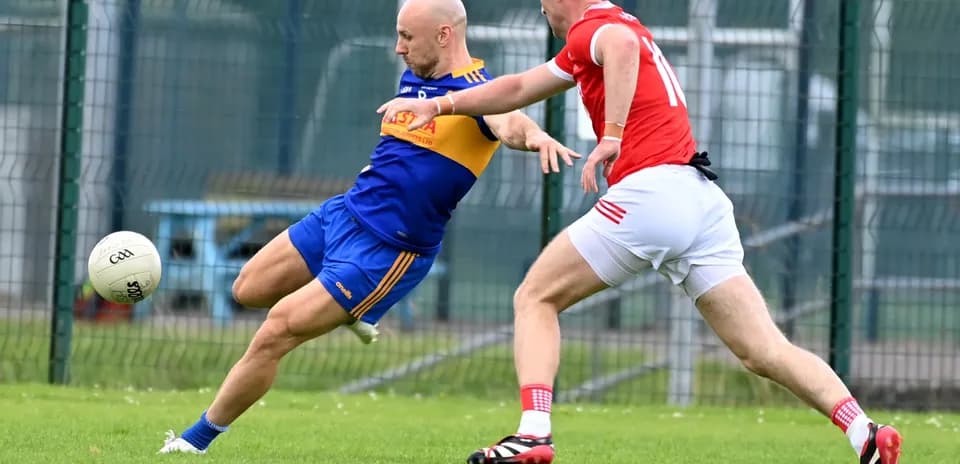 Player attempting to kick ball while being tackled