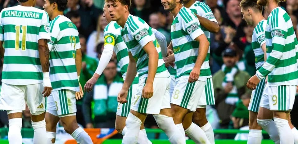 Celtic players celebrating a goal on the pitch