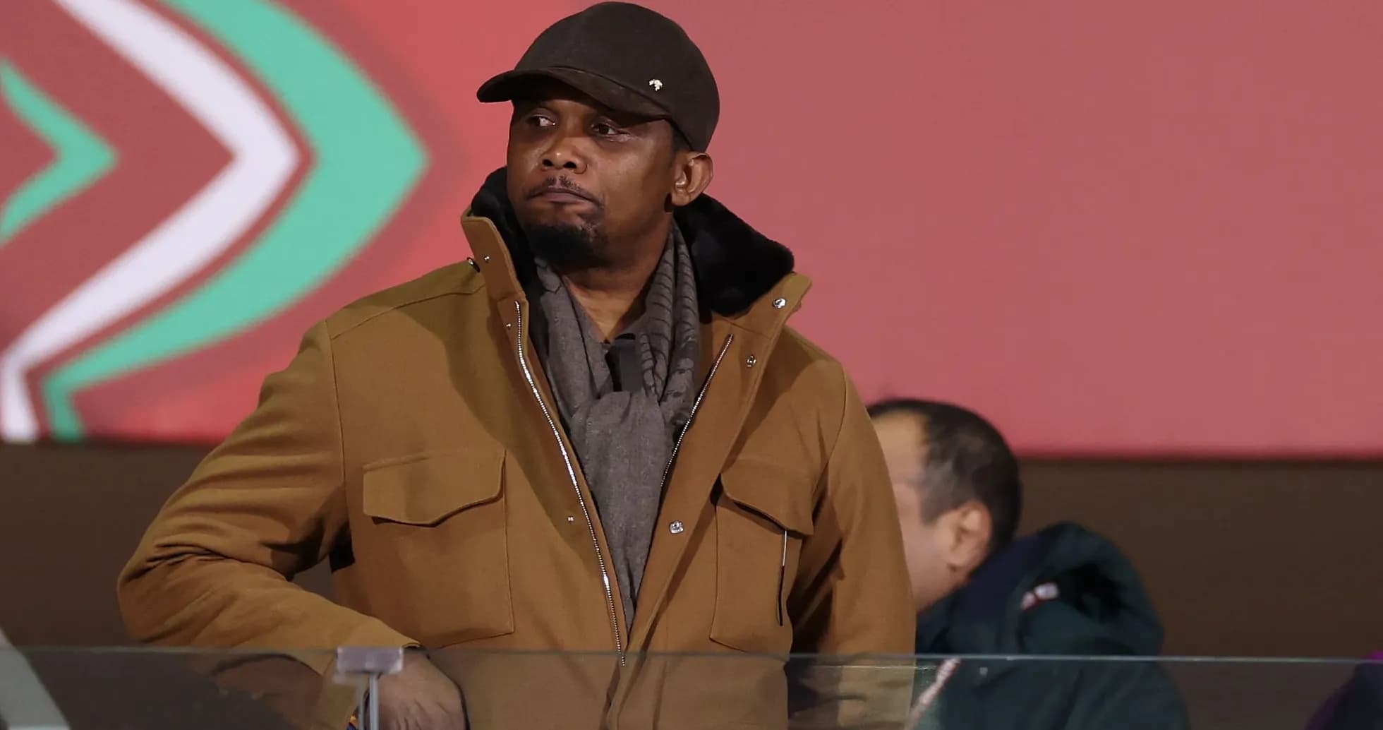 Man in brown jacket at an event