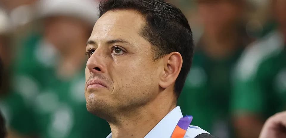 Man with tearful expression at sporting event