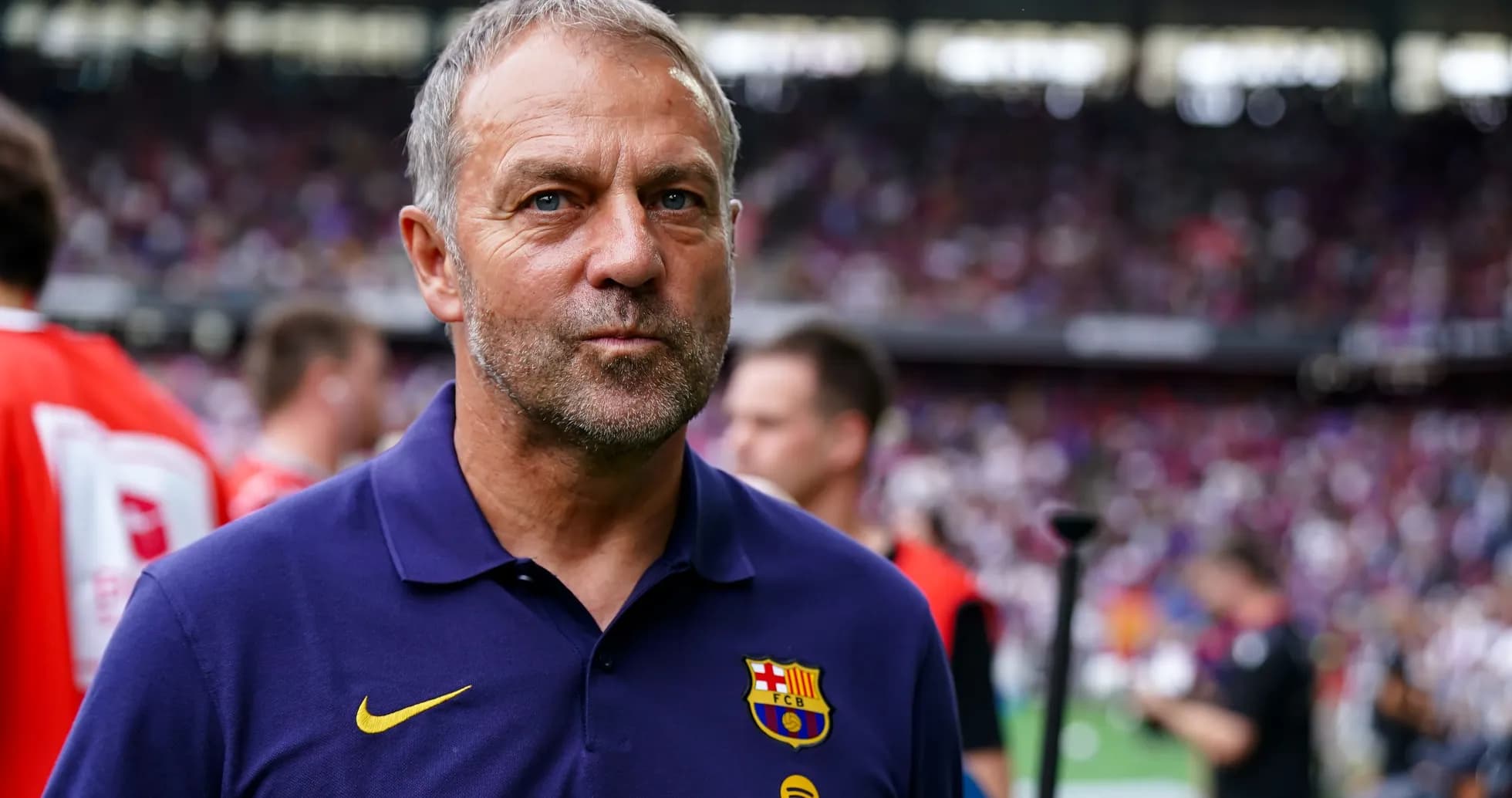 Barcelona coach standing on the sidelines during match