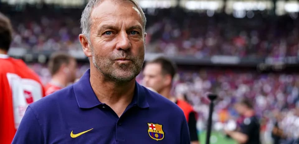 Barcelona coach standing on the sidelines during match