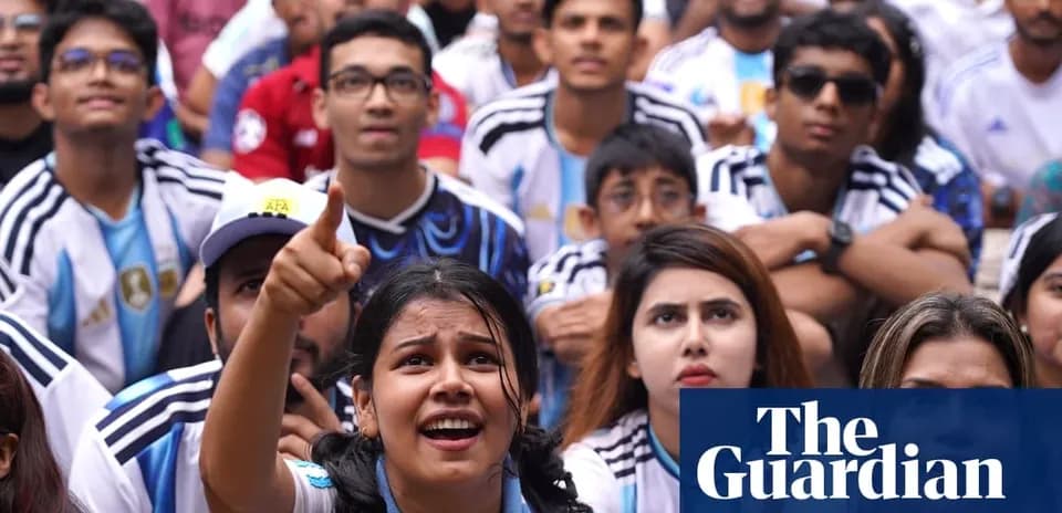 Fans watching a football match, supporting Argentina