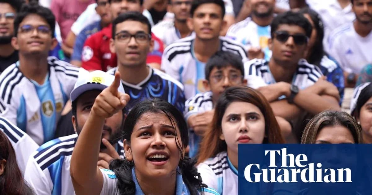 Fans watching a football match, supporting Argentina