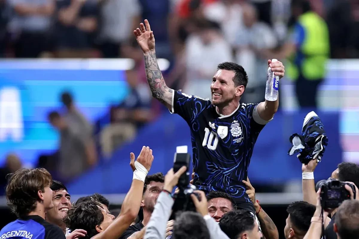 Lionel Messi celebrating with teammates after victory