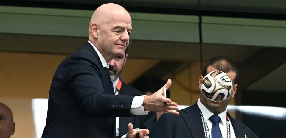 FIFA president Gianni Infantino tossing a football