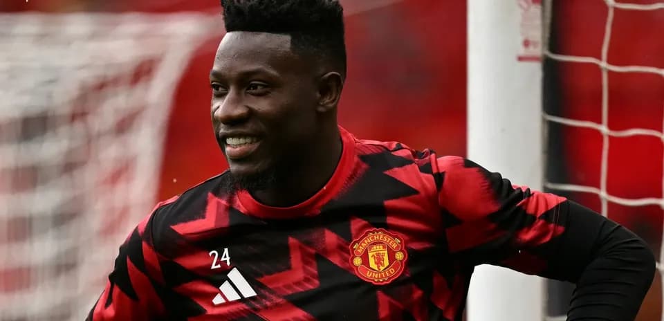 Manchester United goalkeeper smiling during warm-up