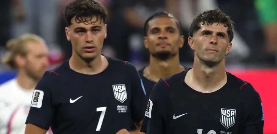 US men's national team players walking off field