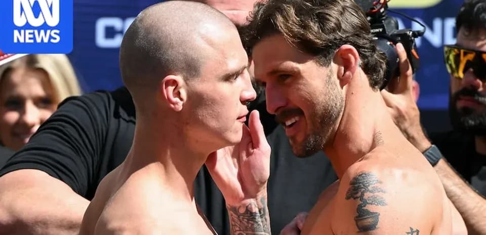 Two fighters facing off at weigh-in event