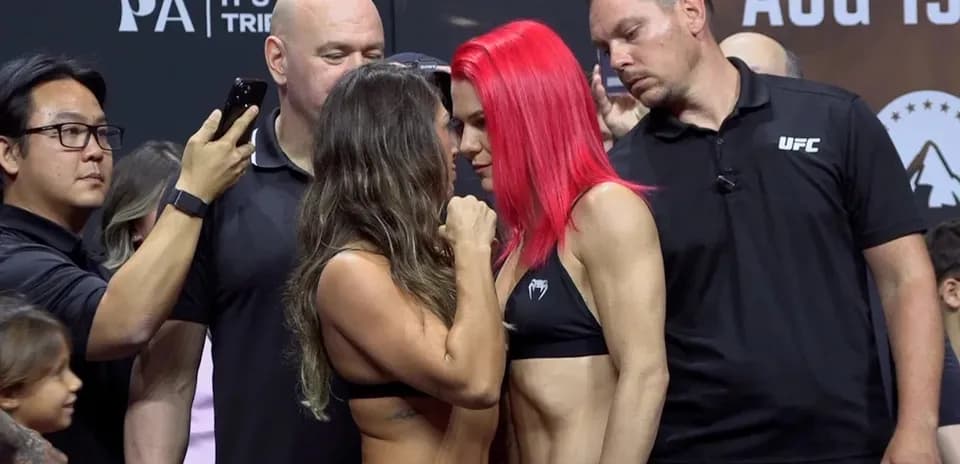 Two fighters facing off at weigh-in event