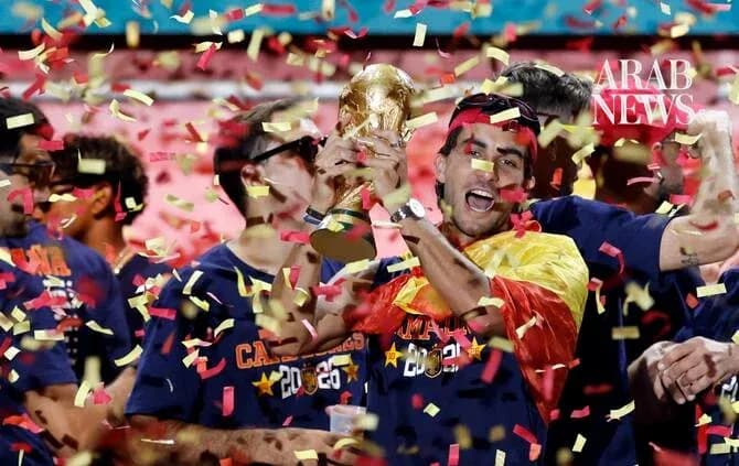 Jubilation as player holds World Cup trophy