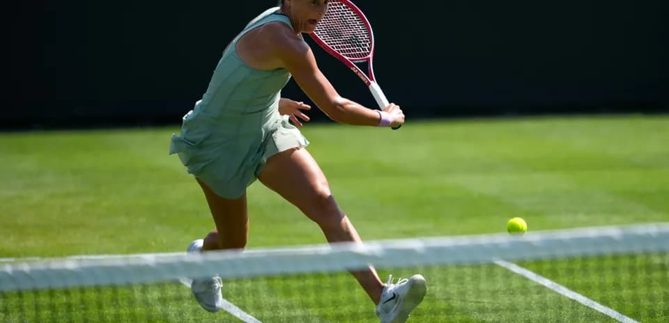 Tennis player hitting a ball during a match