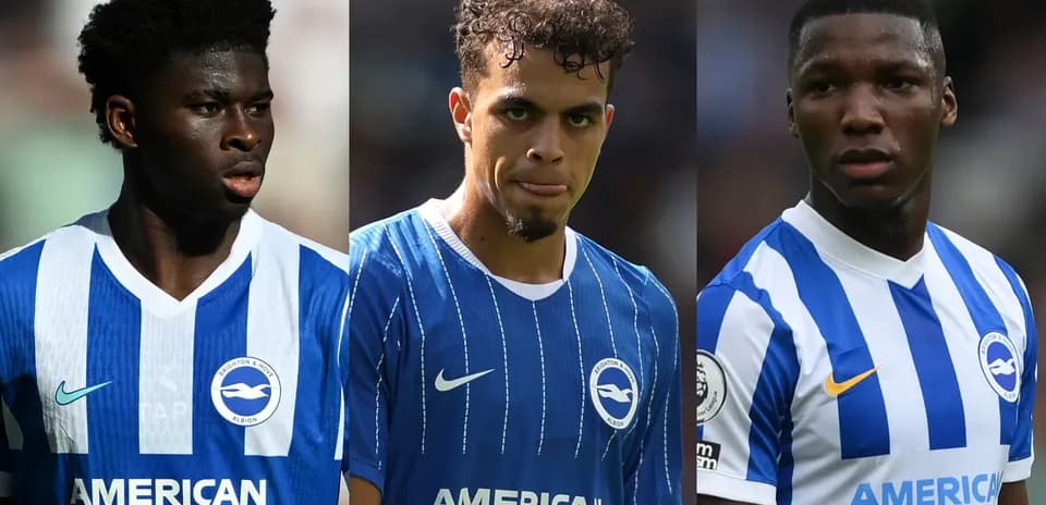 Three Brighton players in team jerseys on pitch