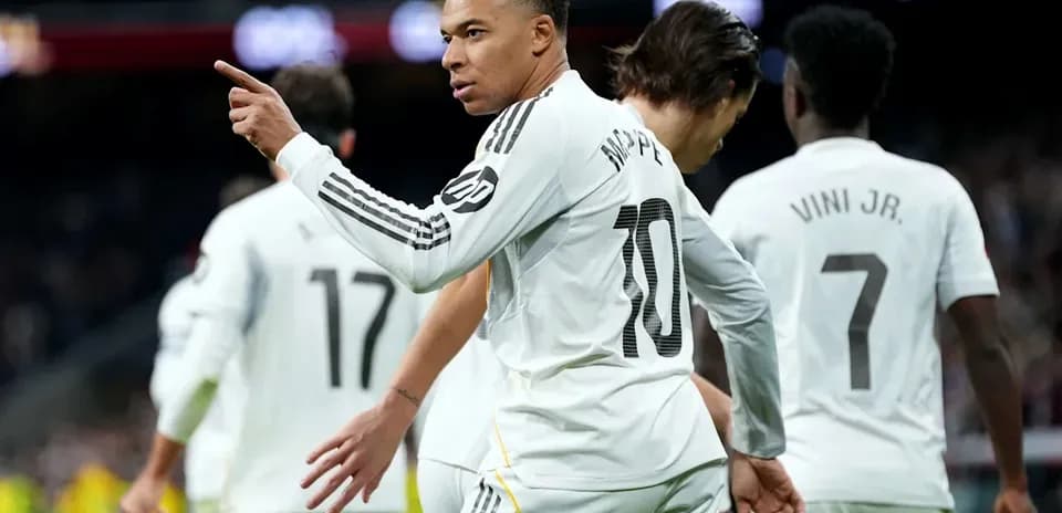 Mbappe celebrating with teammates after scoring goal