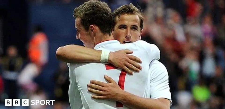 Two football players embracing after a match