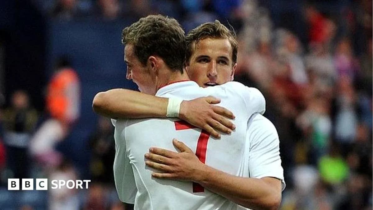 Two football players embracing after a match