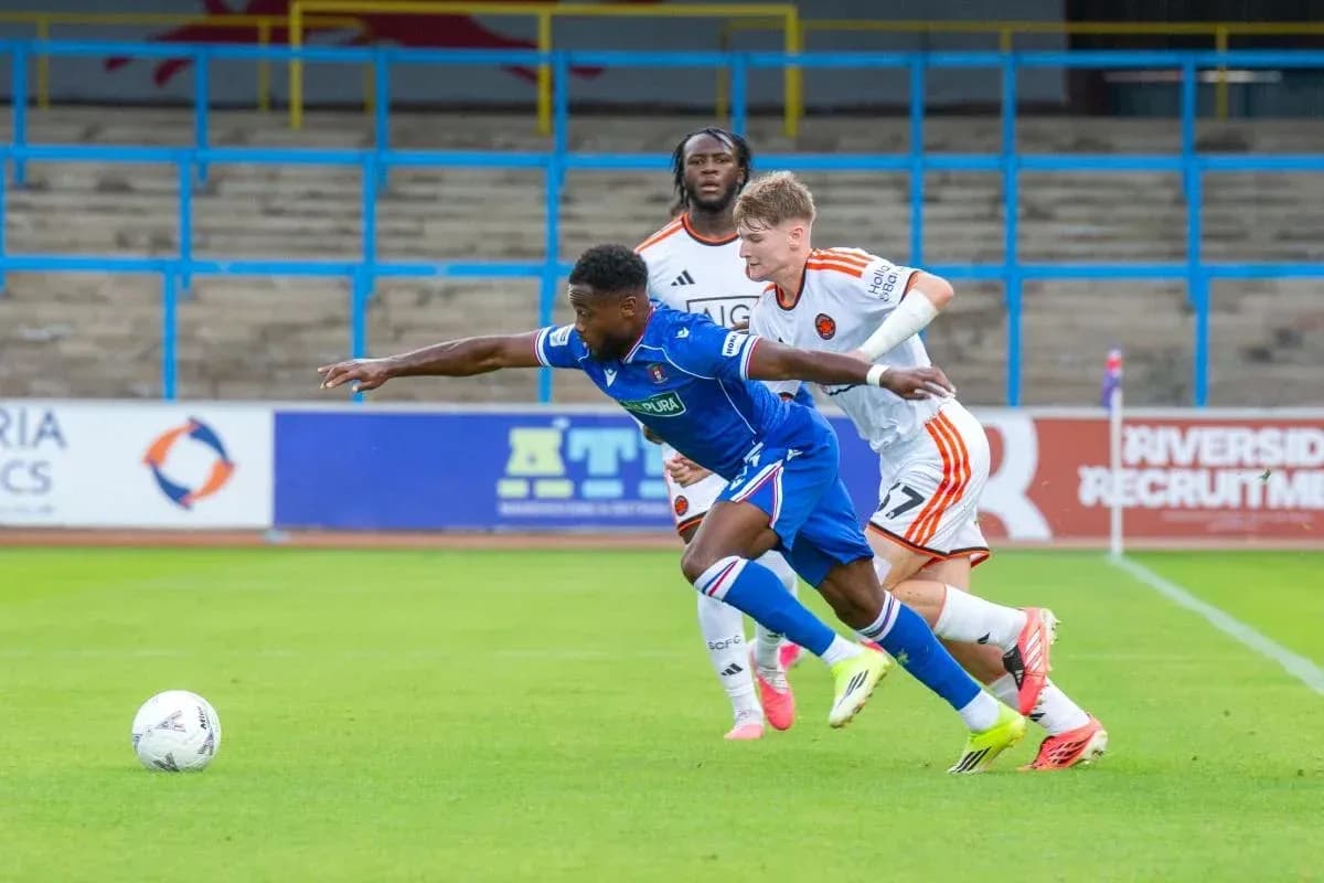 Player tackling opponent during football match action