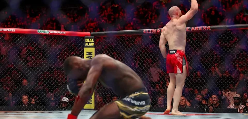 Joe Pyfer celebrating victory over opponent in octagon
