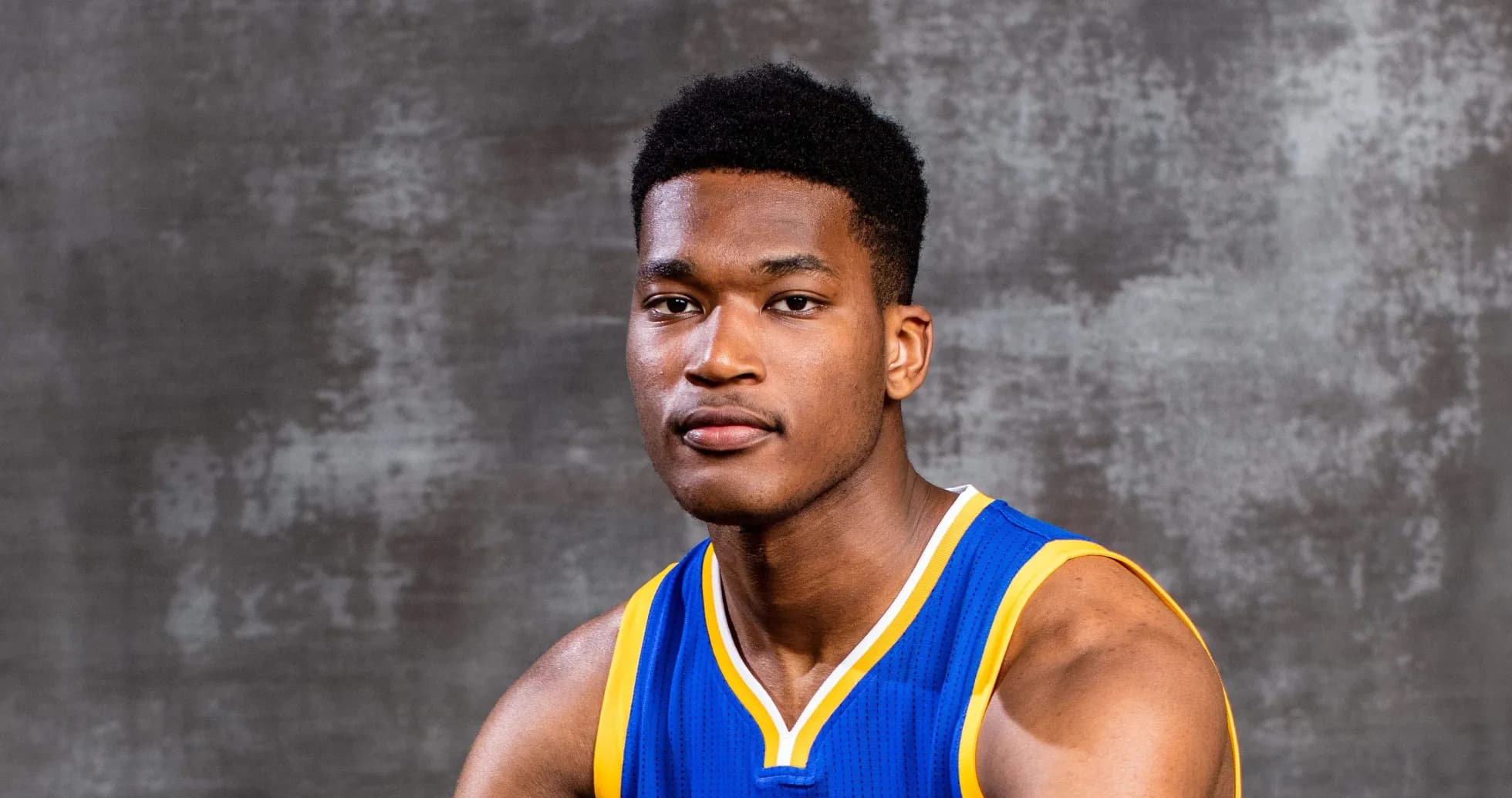 Basketball player posing in team uniform