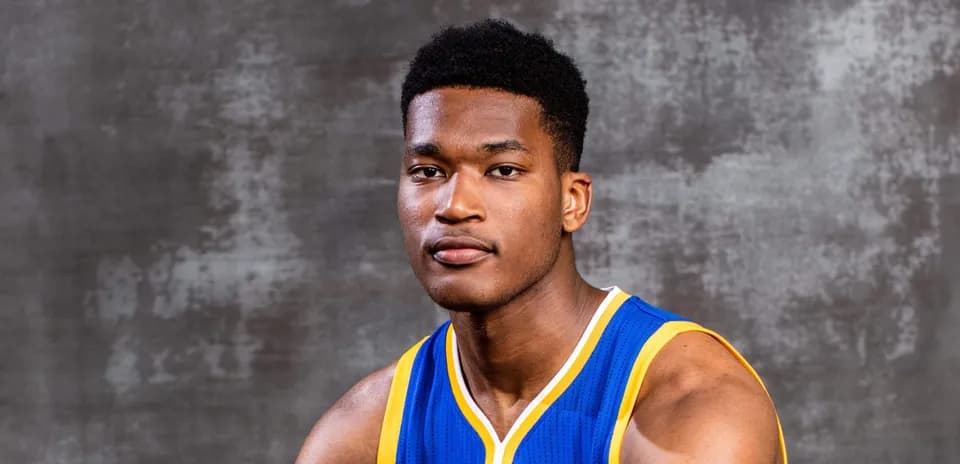 Basketball player posing in team uniform