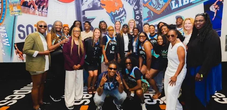 Basketball team and fans posing for group photo