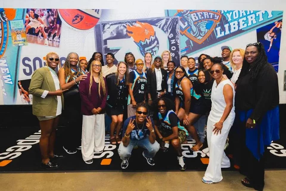 Basketball team and fans posing for group photo