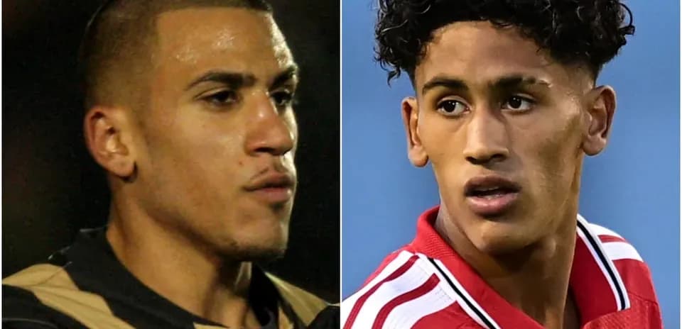 Two football players in profile view