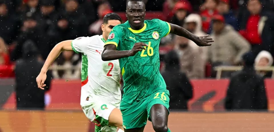 Senegal player sprinting during match against Morocco