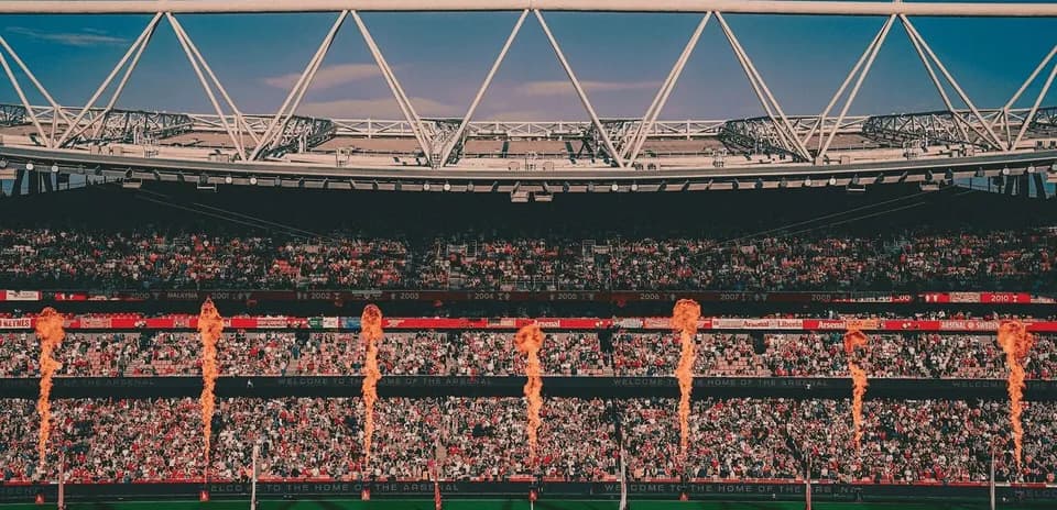 Stadium filled with fans and flame displays