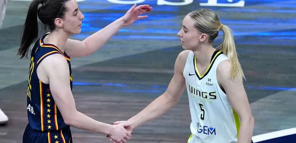Basketball players shaking hands after a match