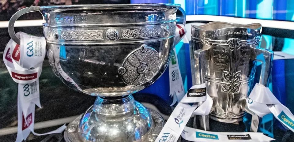 GAA trophies displayed with promotional ribbons