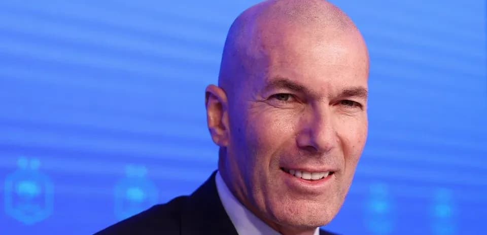 Bald man smiling at press conference backdrop