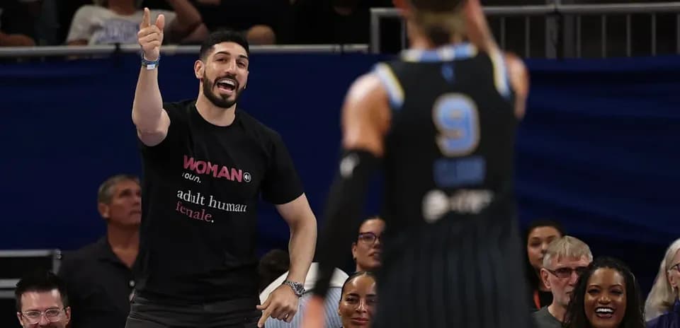 Fan cheering for player during basketball game