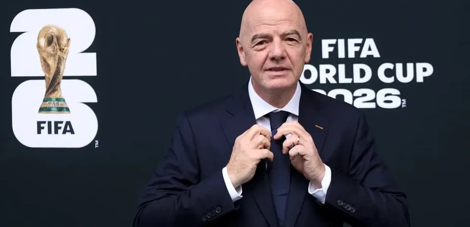 FIFA president adjusting his tie at event