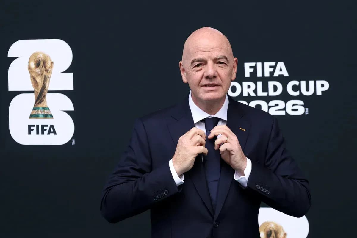 FIFA president adjusting his tie at event