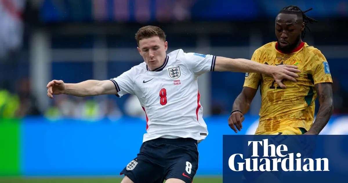 England player tackling opponent during football match