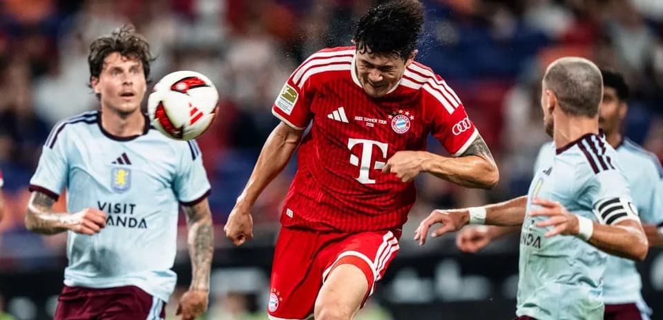 Bayern Munich player heading the ball during match