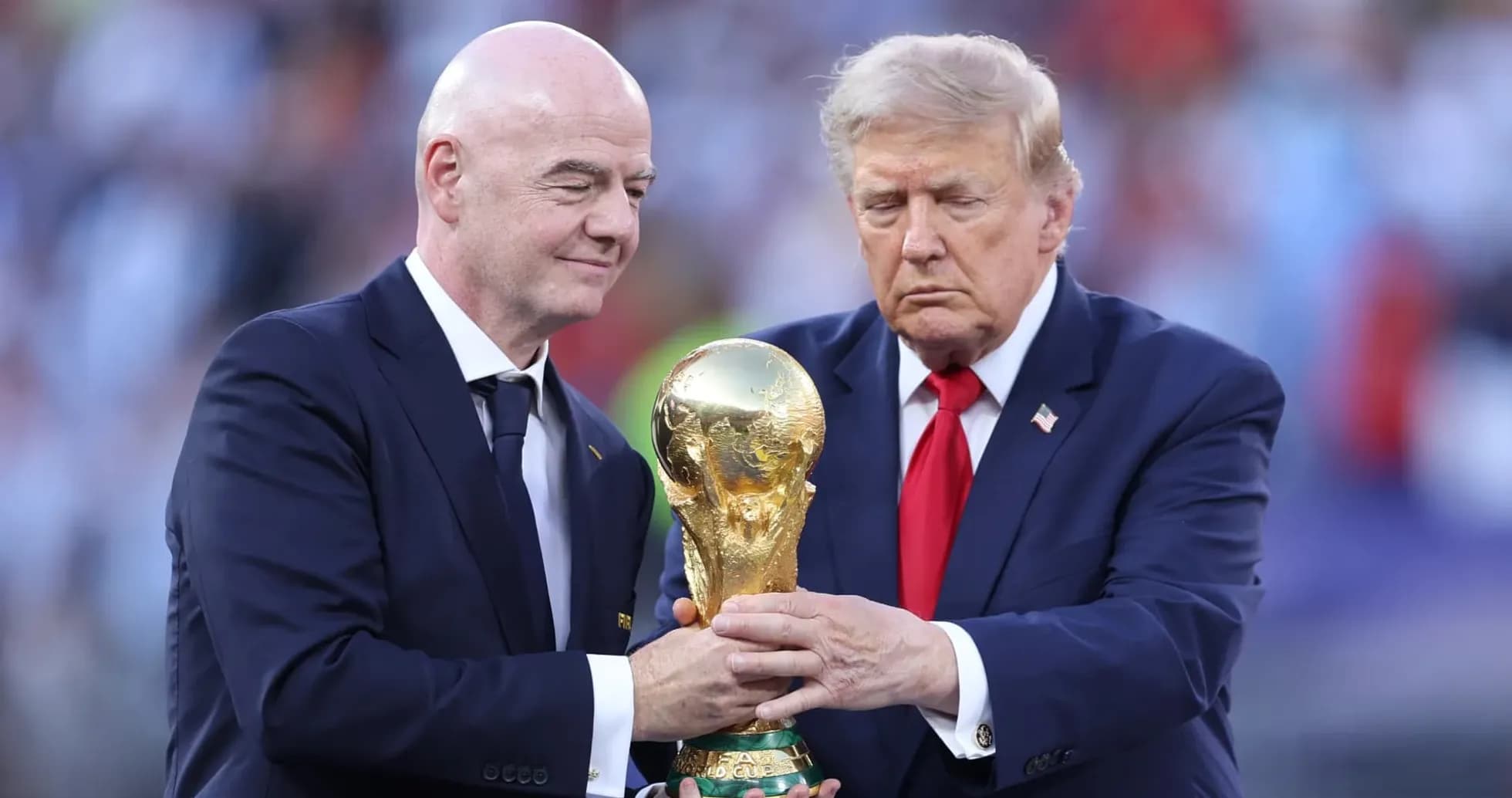 Gianni Infantino and Donald Trump holding World Cup trophy
