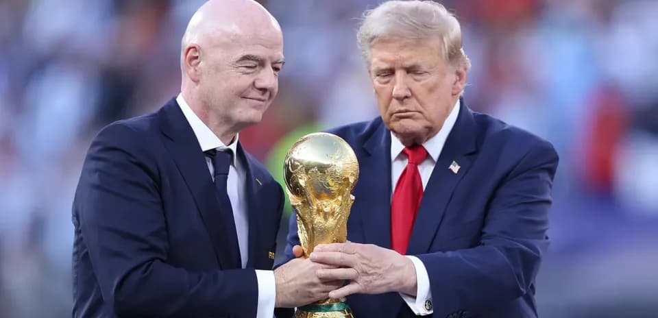 Gianni Infantino and Donald Trump holding World Cup trophy