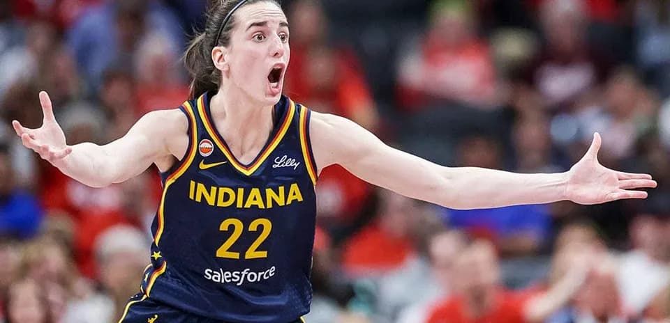 Basketball player gesturing during intense game moment