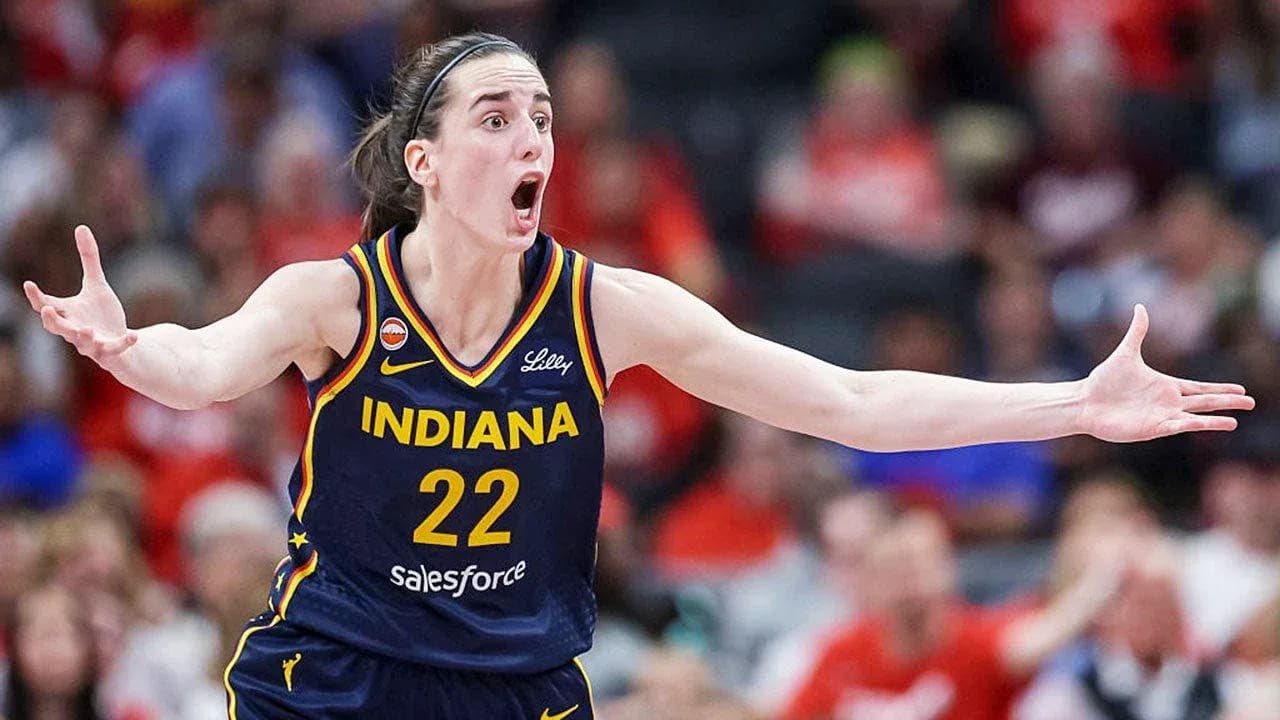 Basketball player gesturing during intense game moment