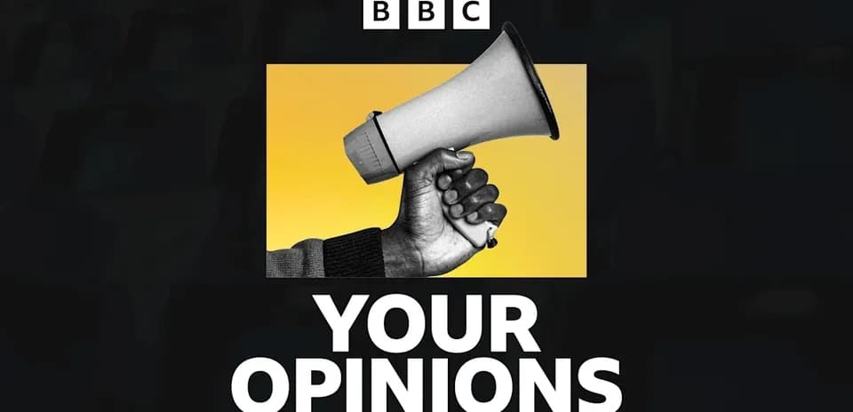 Hand holding megaphone with yellow background