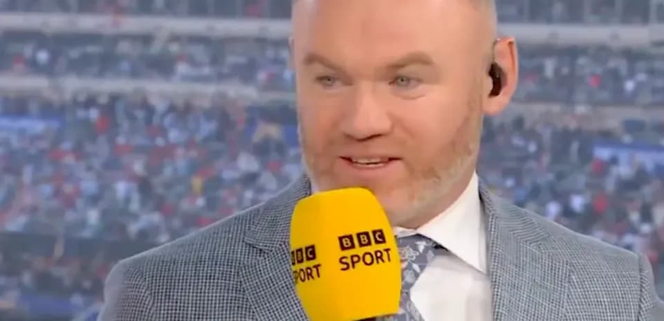 Analyst speaking into microphone during live broadcast
