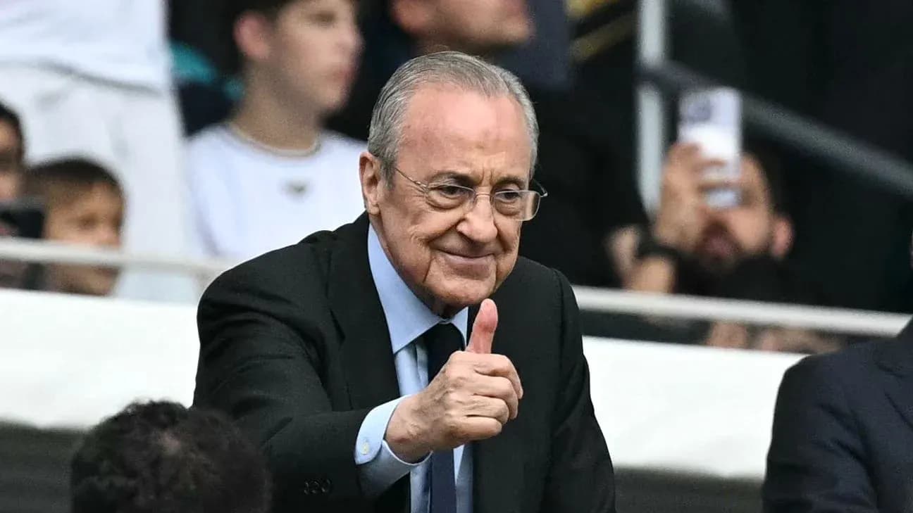 Person giving thumbs up in stadium audience