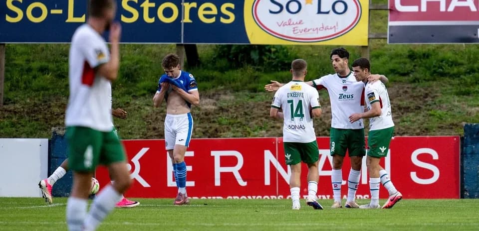 Players celebrating a goal on the pitch