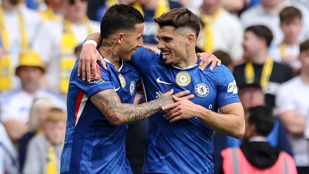 Chelsea players celebrating a goal on the field