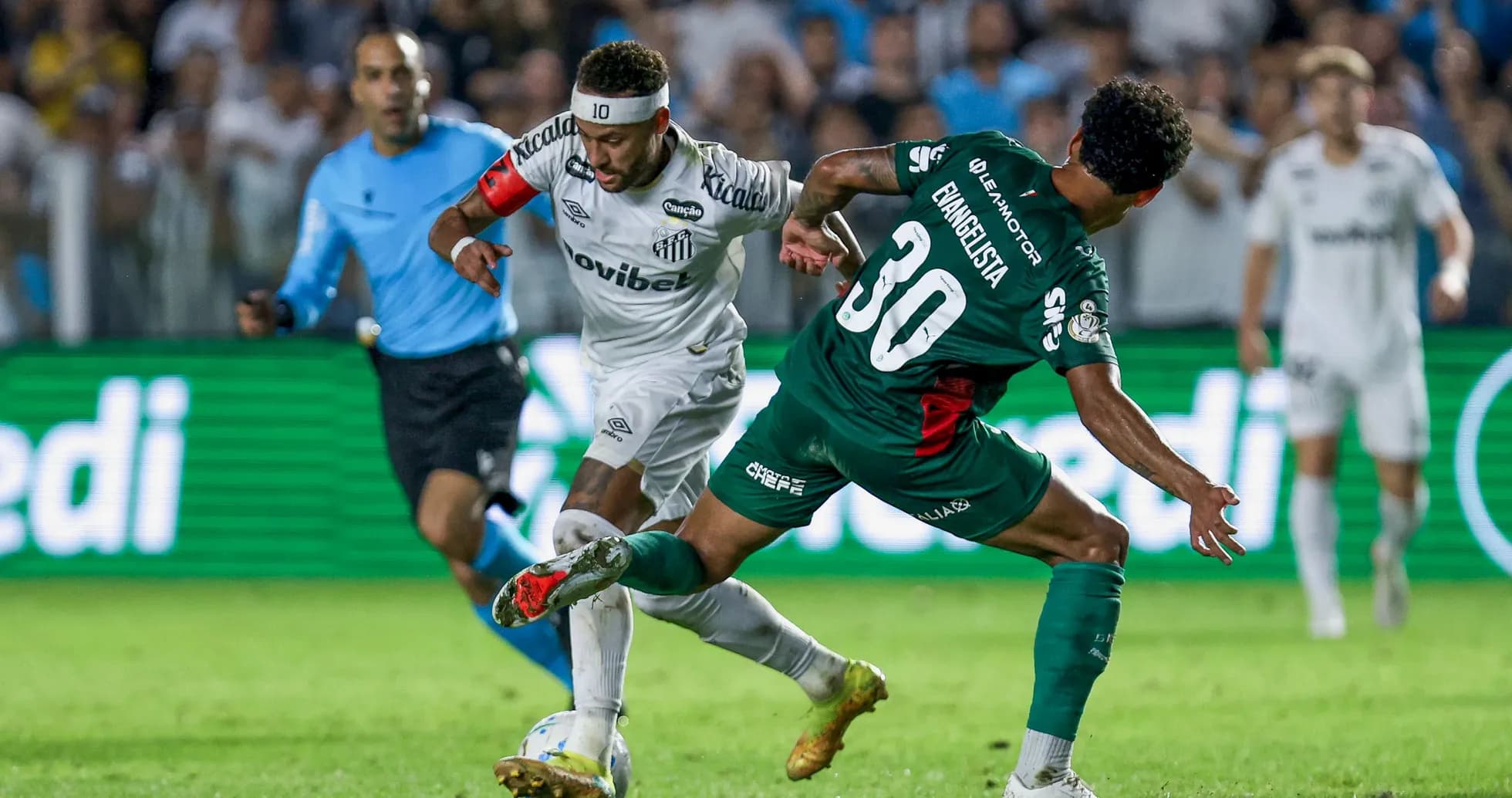 Neymar dribbling past defender during football match