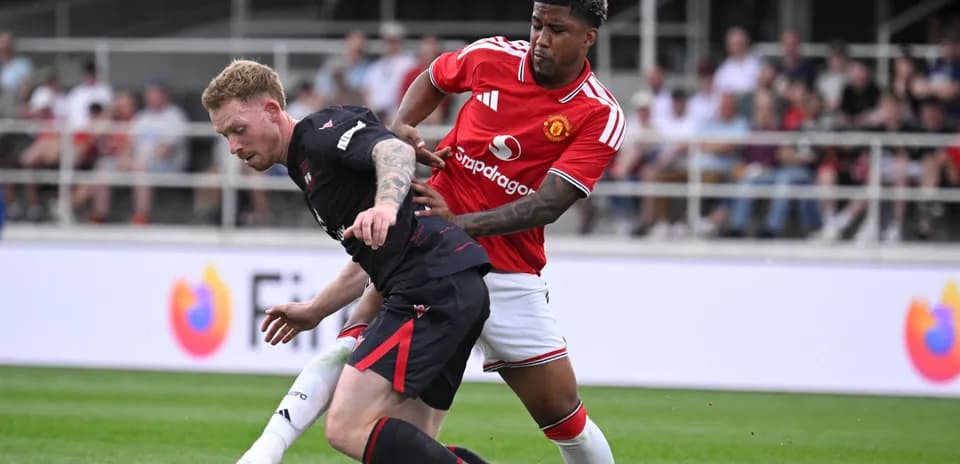 Two players competing for the ball during match